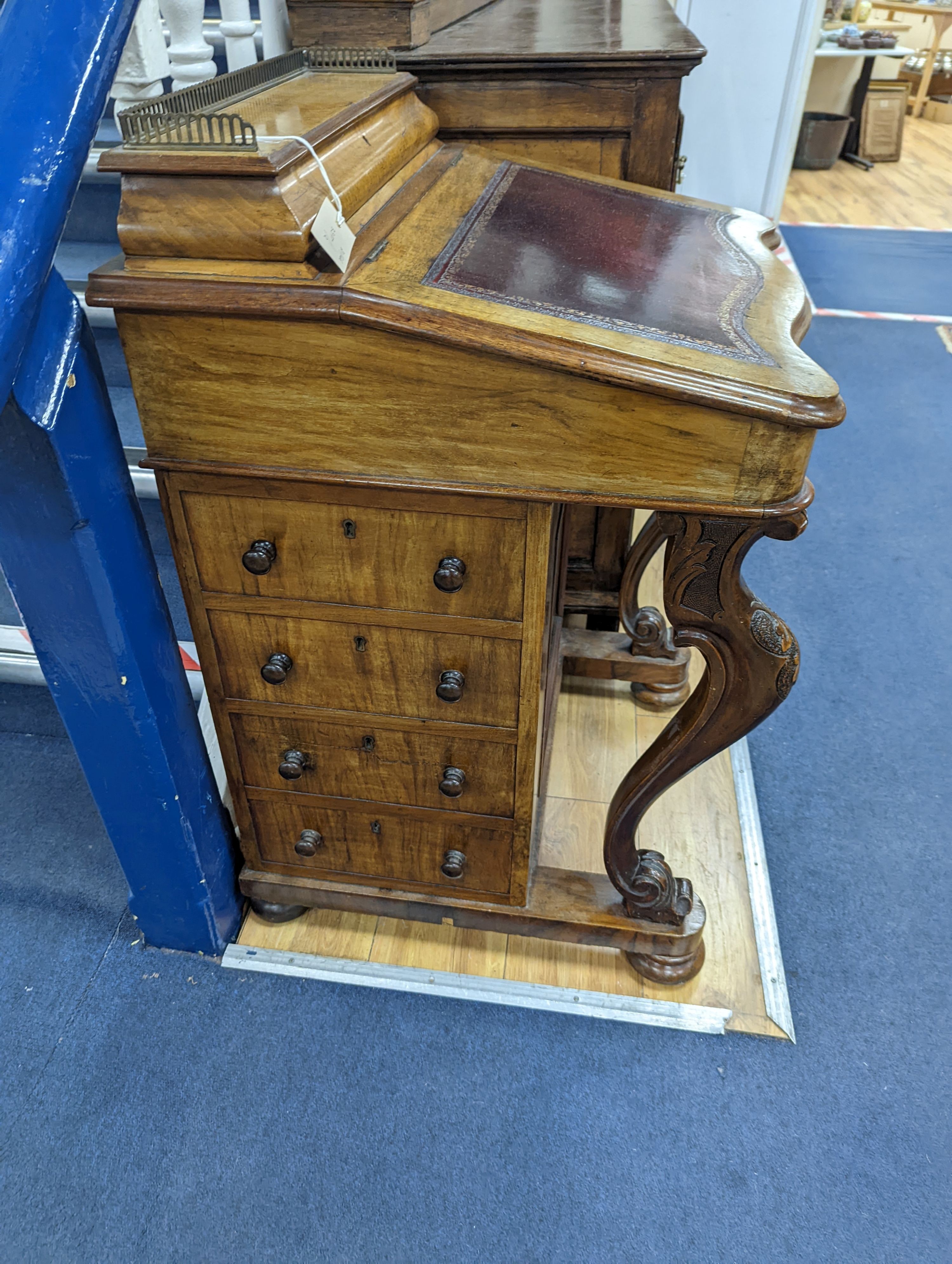 A Victorian walnut Serpentine fronted Davenport, width 55cm
